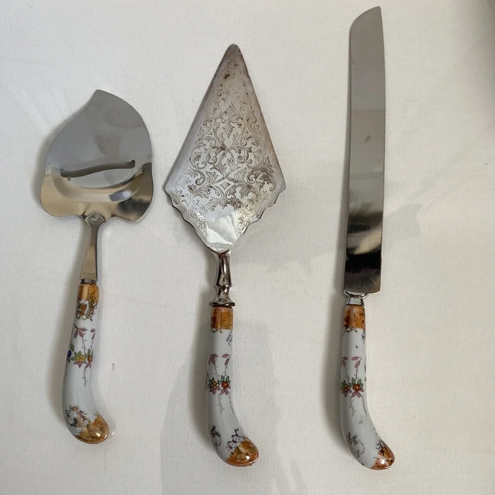 Lovely set of vintage serve ware with floral porcelain handles