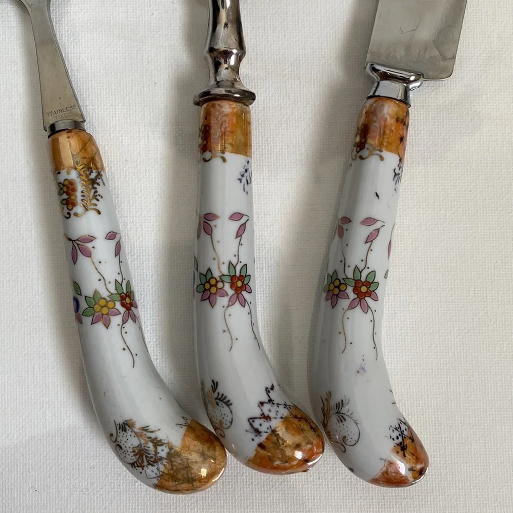 Lovely set of vintage serve ware with floral porcelain handles