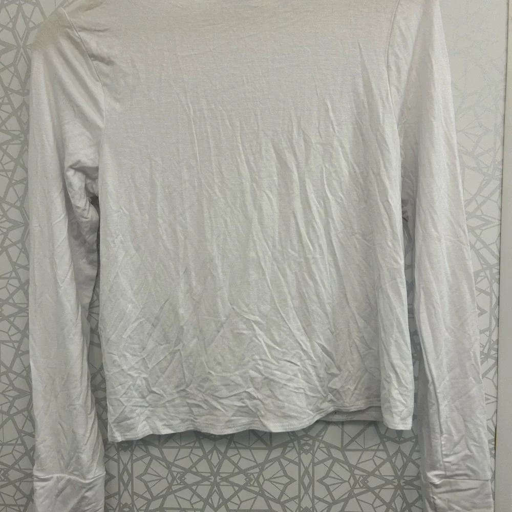 2 new white Terez tops with some light flaws. Girls size XL tie & cross fronts