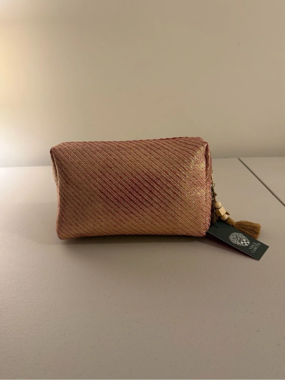Vince Camuto sleek cosmetic