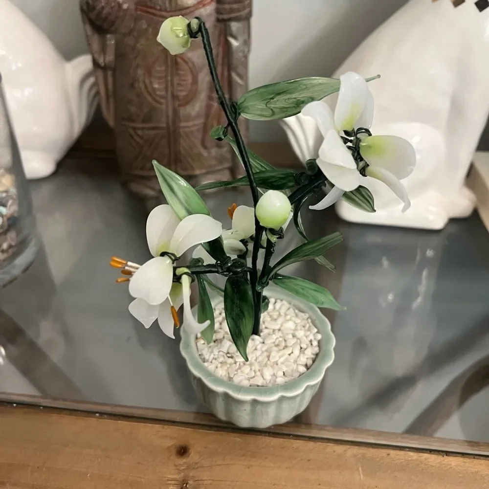 Vintage jade quartz tree in celadon pot. White and Green Plant.