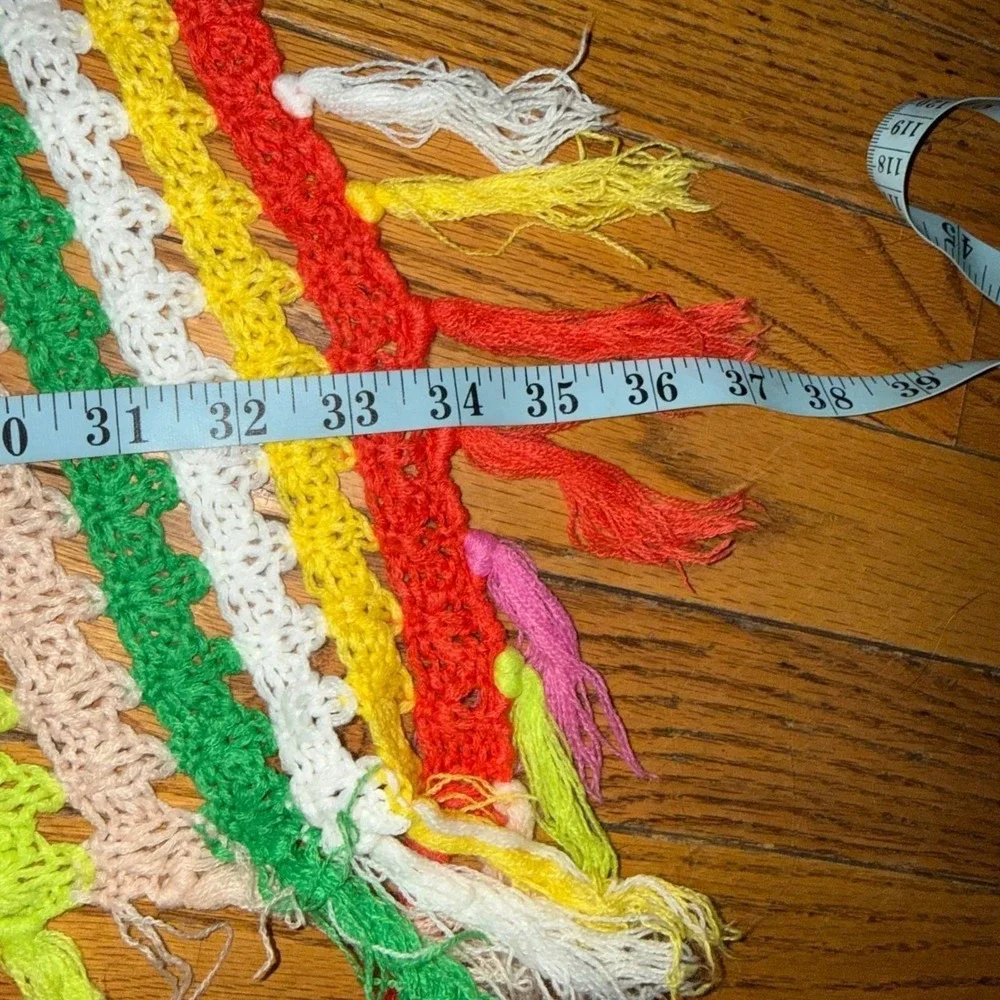 3.1.5 multicolored crochet throw blanket with a striped pattern and fringe trim