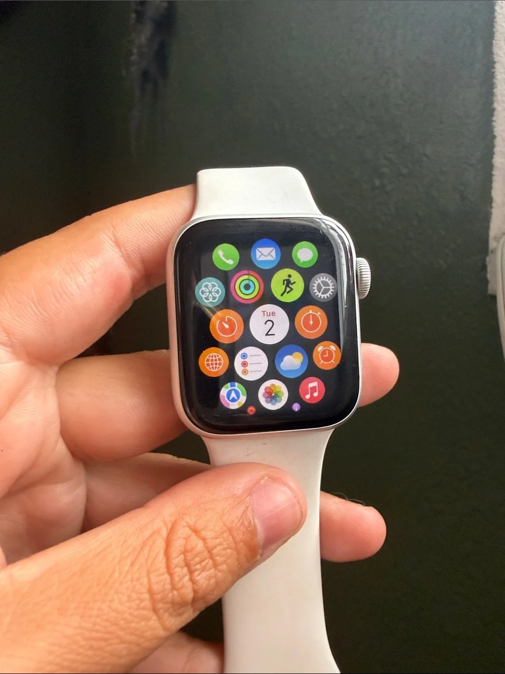 Apple Watch with White Sport Band and Lavender Charging Holder