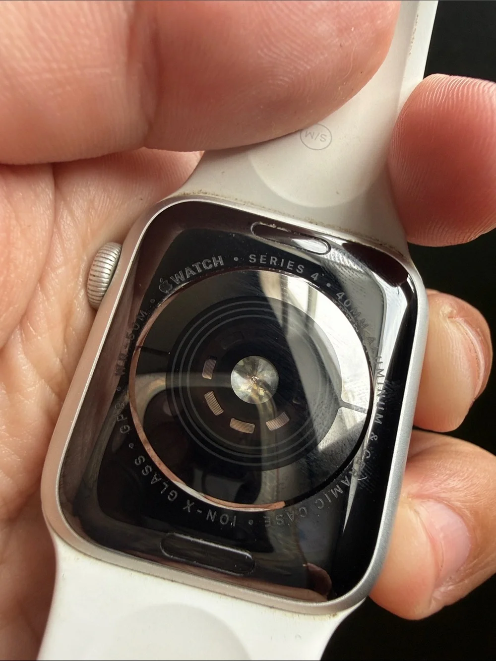 Apple Watch with White Sport Band and Lavender Charging Holder