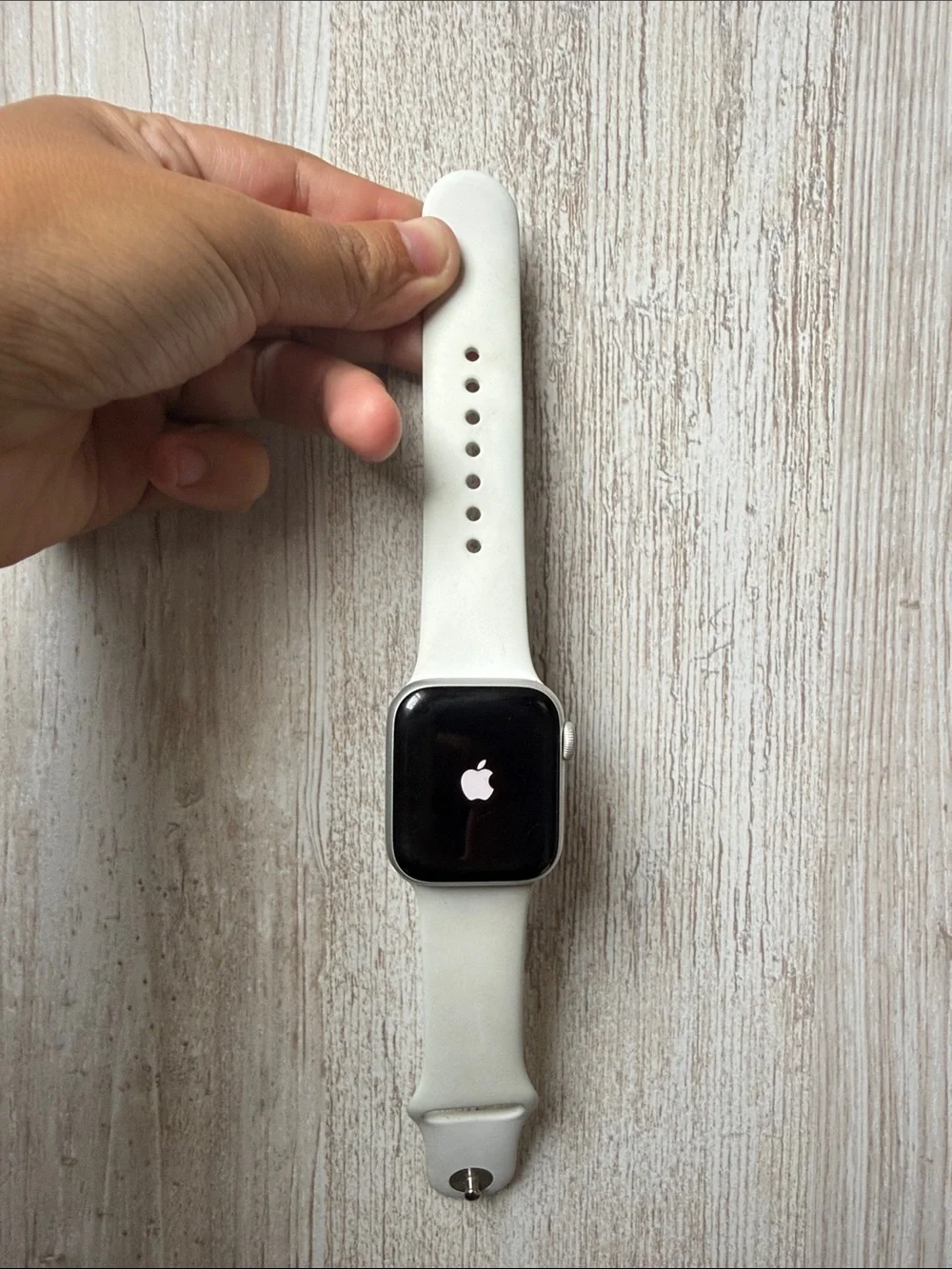 Apple Watch with White Sport Band and Lavender Charging Holder