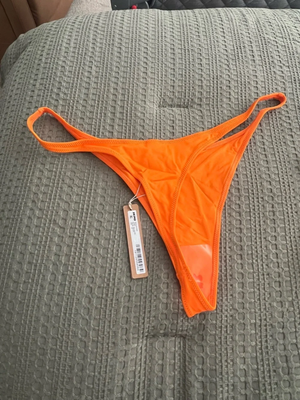 SKIMS vibrant orange
