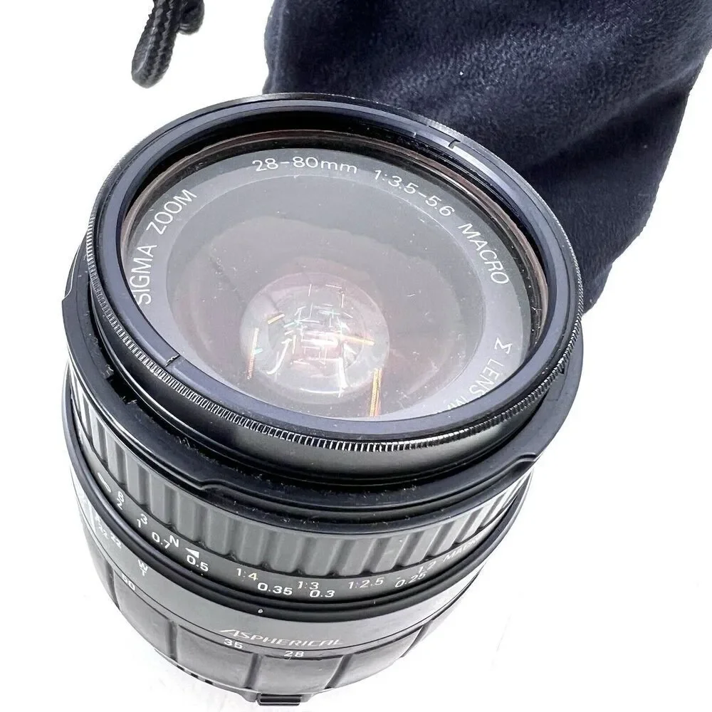 Sigma 28-80f/3.5-5.6 Aspherical Macro Lens w/a Tiffen Sky 1A Filter & Carry Bag