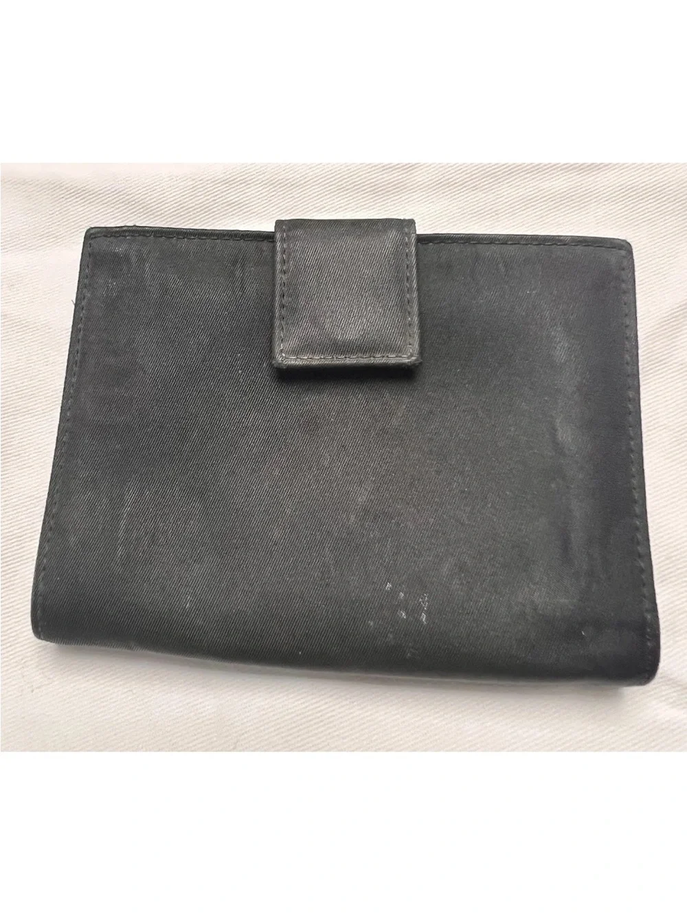 Prada wallet prominent