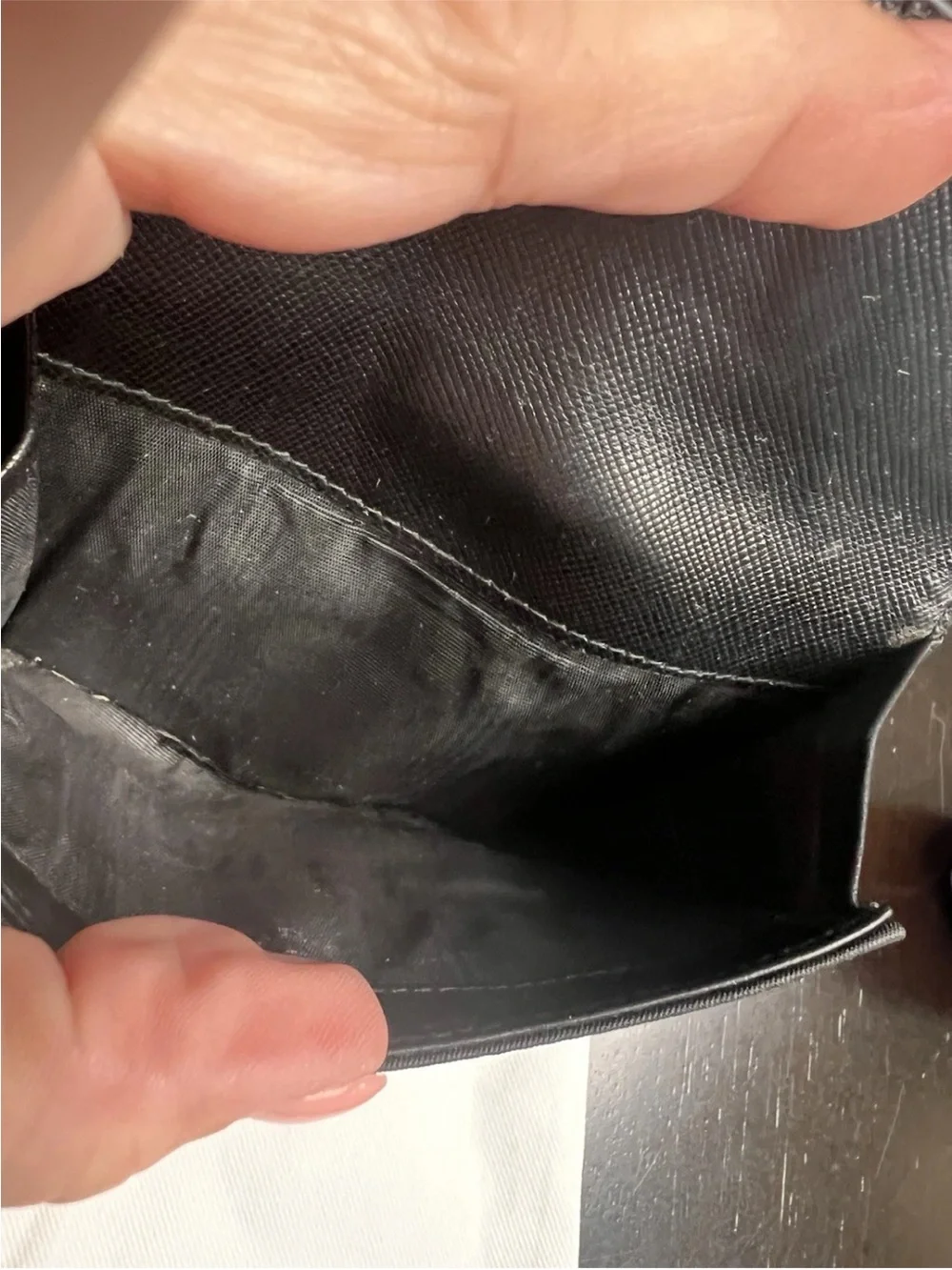 Prada wallet prominent