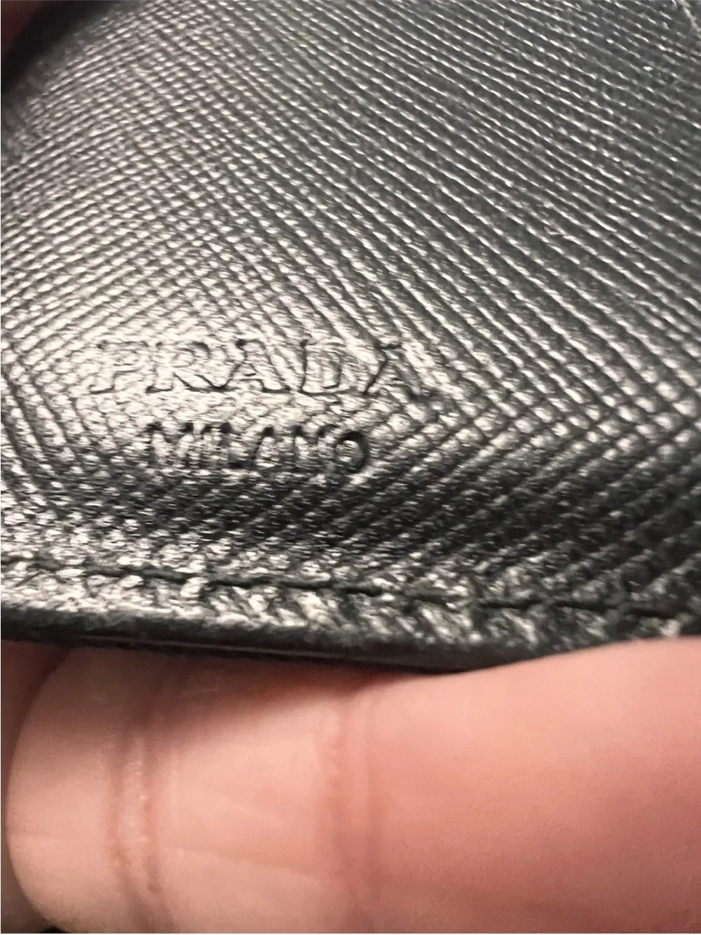 Prada wallet prominent