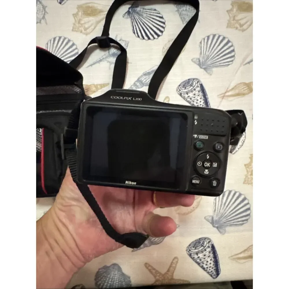 Nikon Black Camera with Matching Black Carry Case and Red Trim