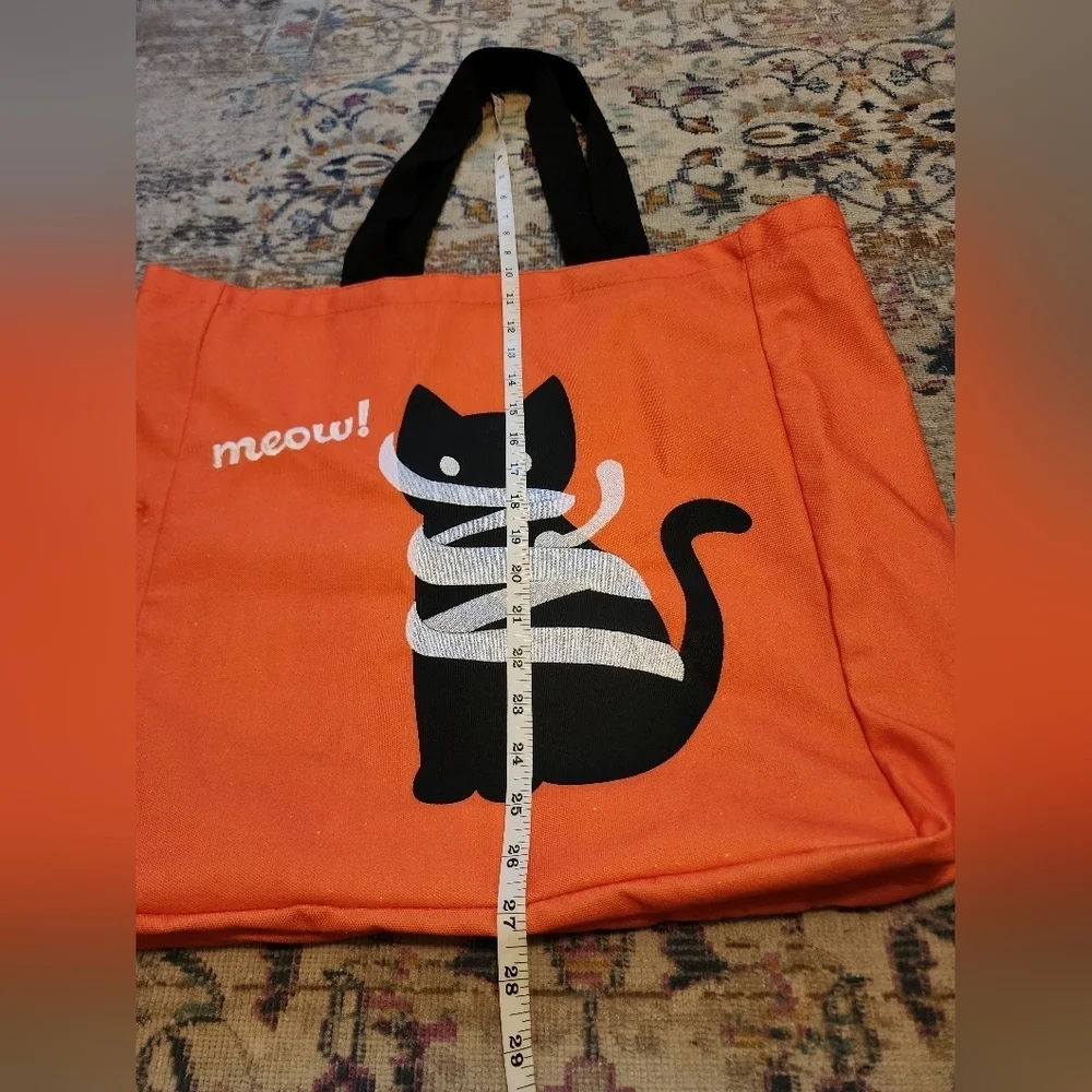 Source Unknown cat seller tote
