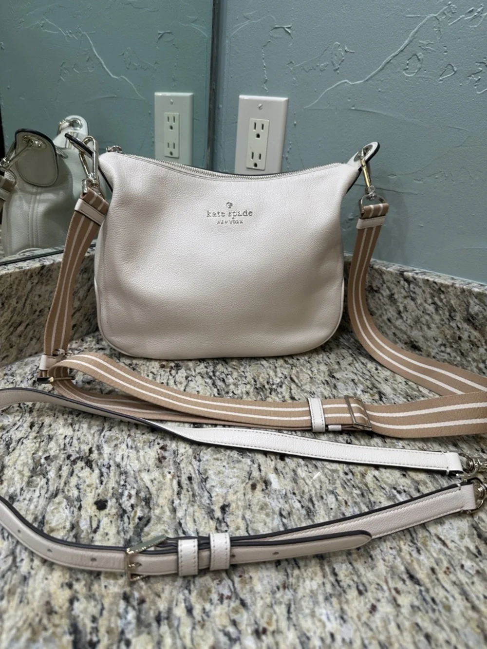 Kate Spade women’s ivory leather cross body purse or regular hand bag