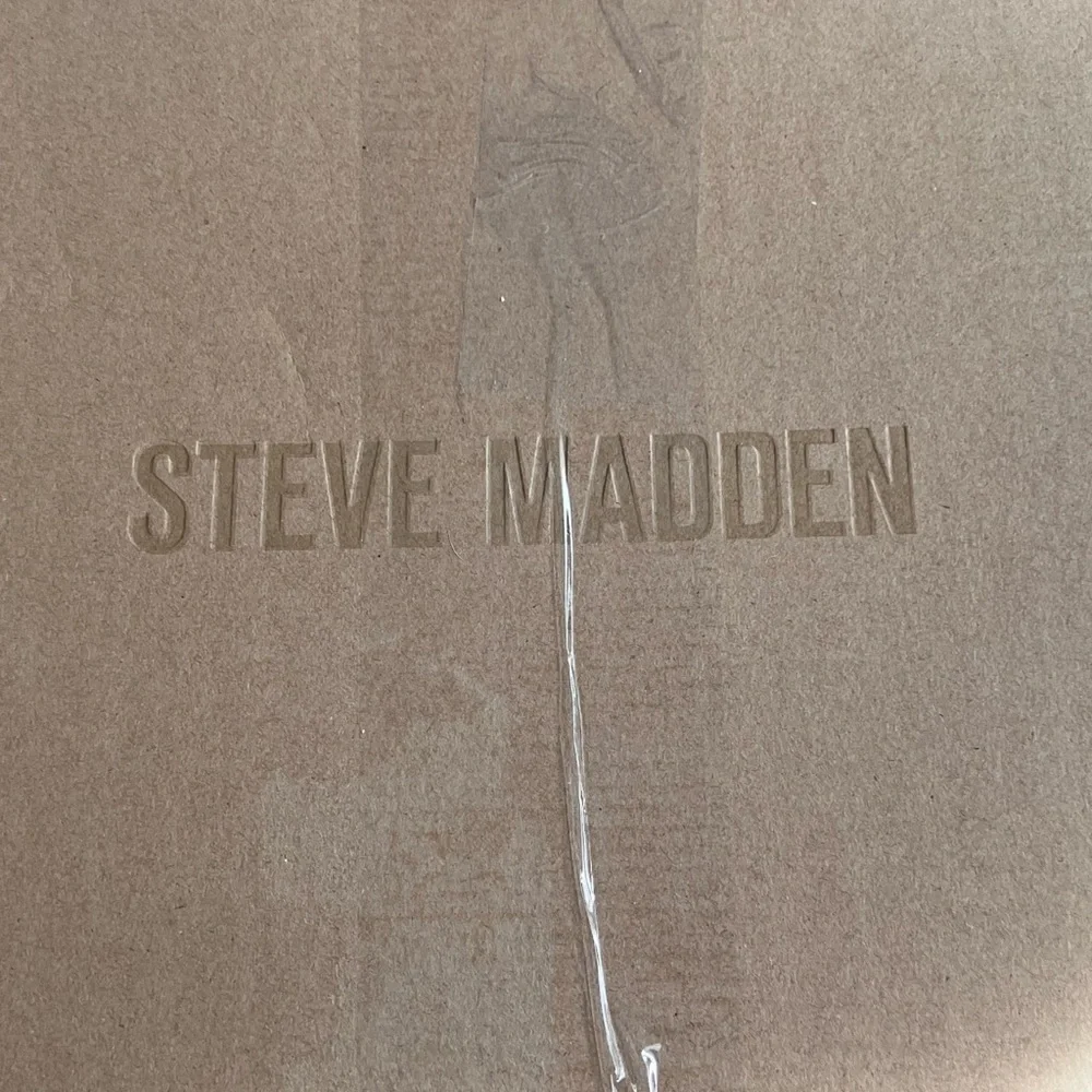 Steve Madden 10” shaft shearling