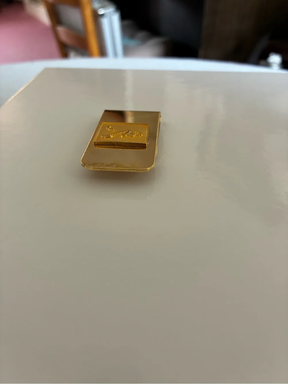 Source Unknown sleek gold