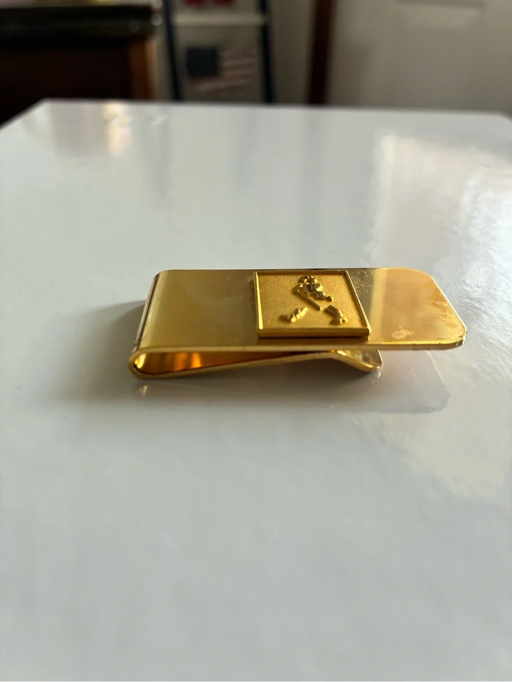 Source Unknown sleek gold