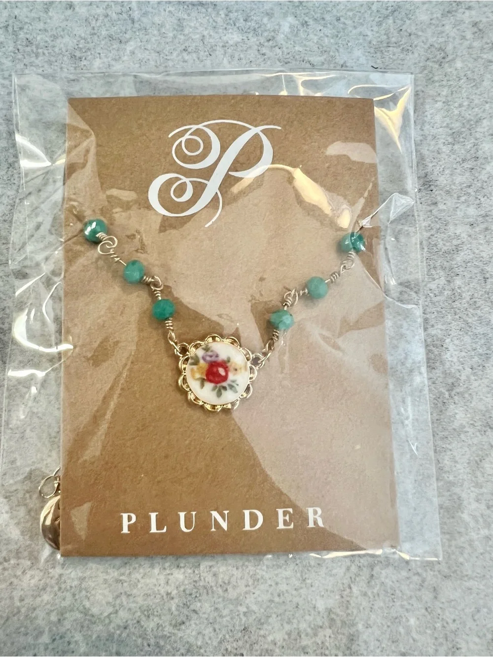 Plunder gold tone