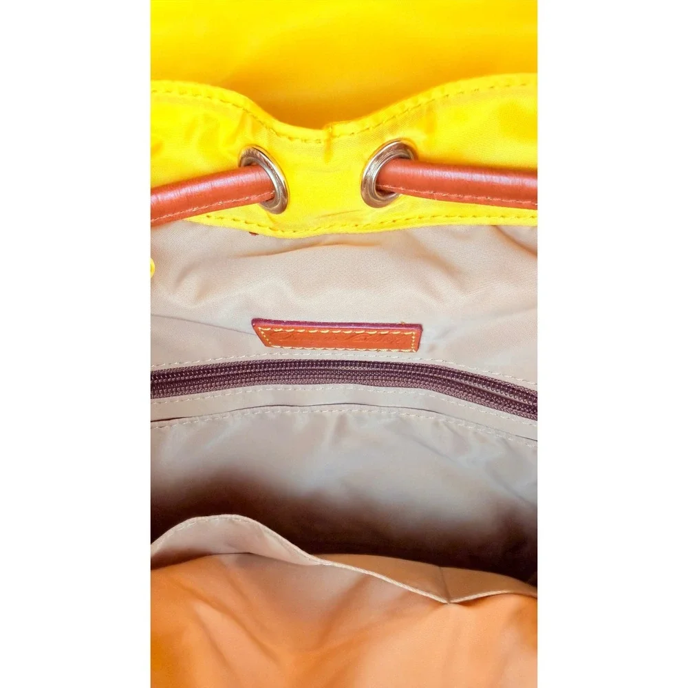 Dooney & Bourke Nylon Murphy Backpack Flap Tassel Drawstring Womens Yellow
