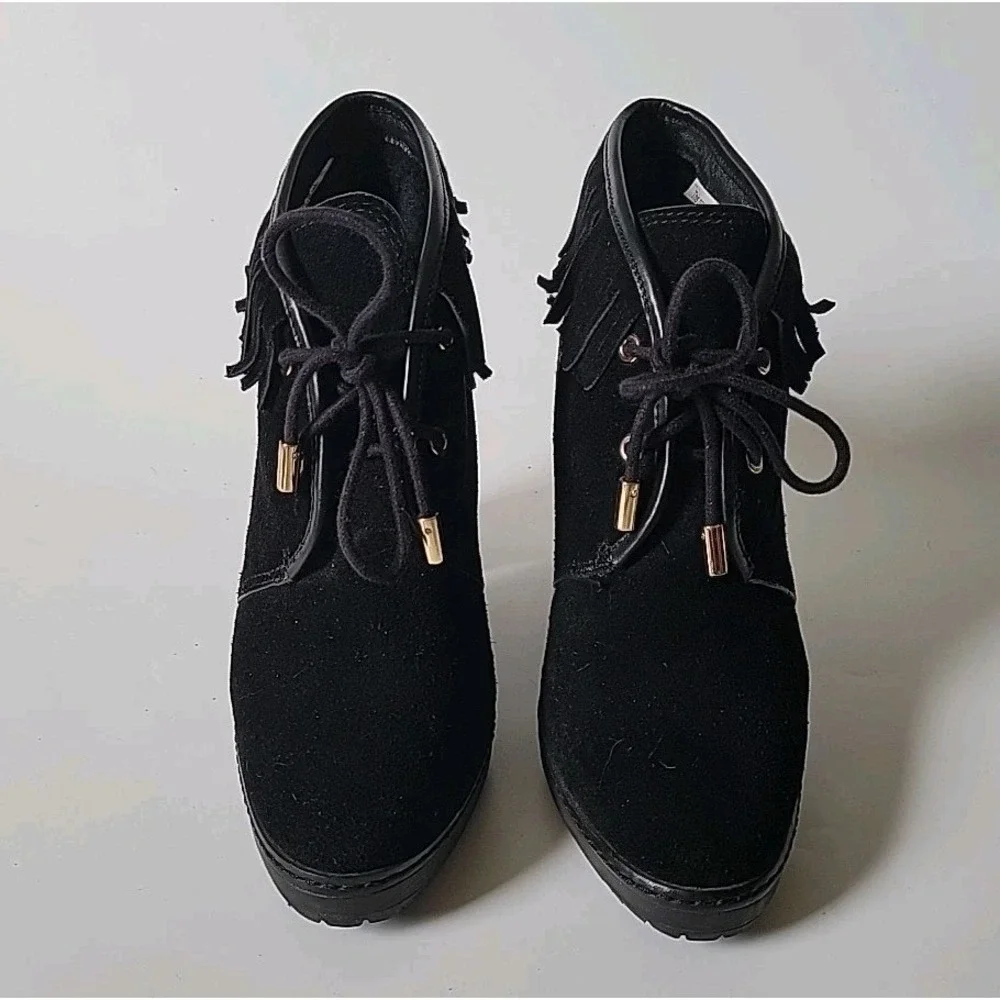 Tory Burch features black