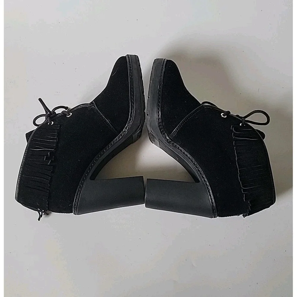 Tory Burch features black