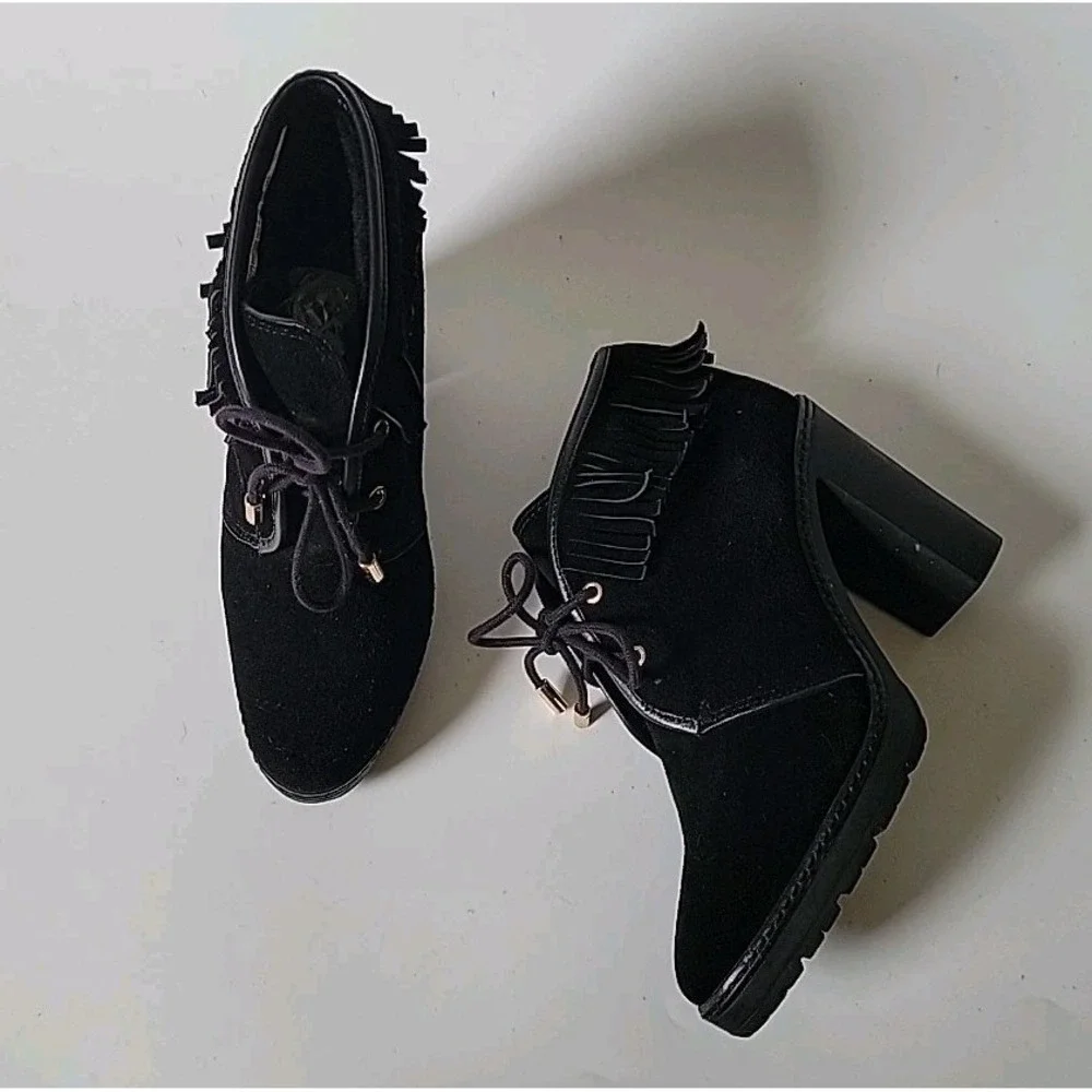 Tory Burch features black