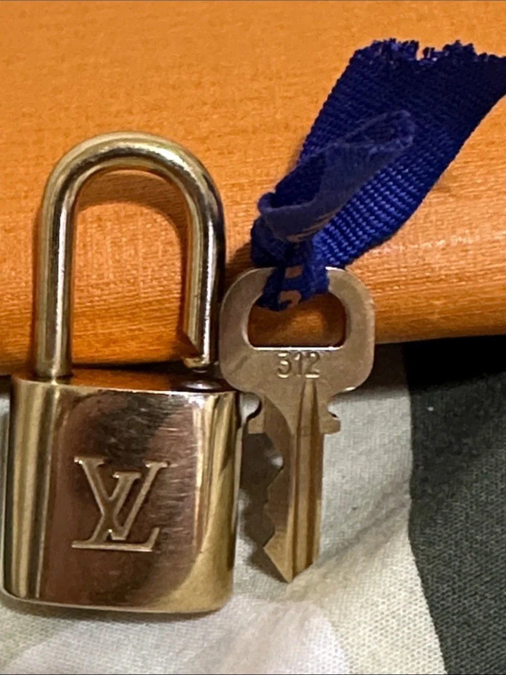 Louis Vuitton lock hardware signs