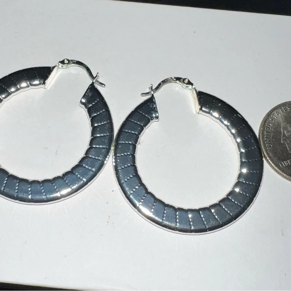 Shiny silver tone hoop earrings 2” length‎