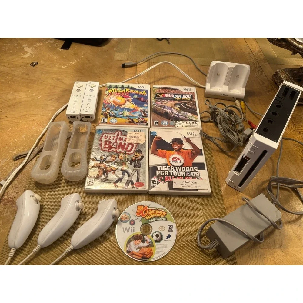 Nintendo Wii Console bundle + 5 games w  2 remotes 3 nunchucks wires and charger