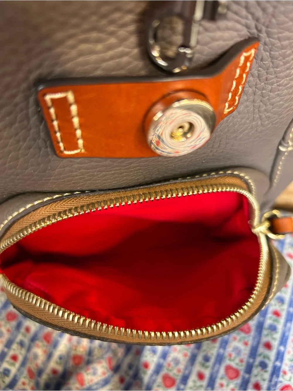 Dooney & Bourke snap country rich