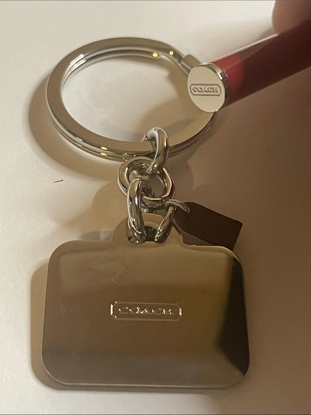 Coach paired key silver
