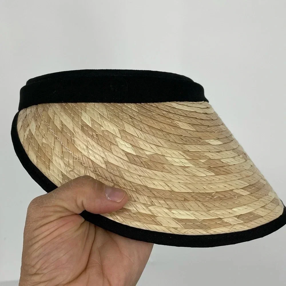 Straw visor with black trim.  Terry cloth lining