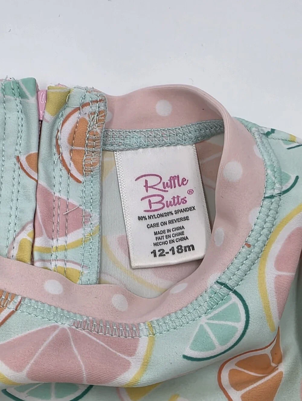 Ruffle Butts baby girl fruit print rashguard swimsuit size 12-18 months