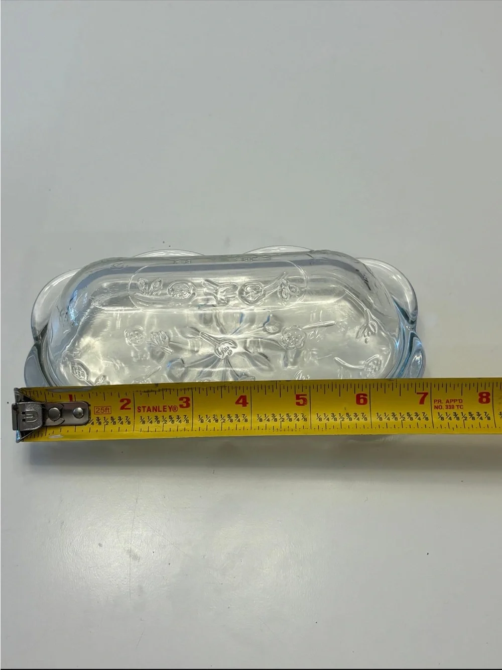 Anchor Hocking Savannah butter dish features a pressed clear glass design flower