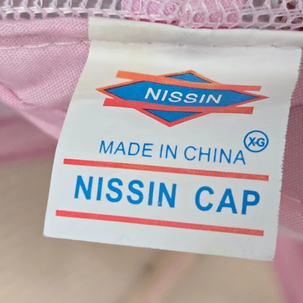Nissin Cap spread positivity