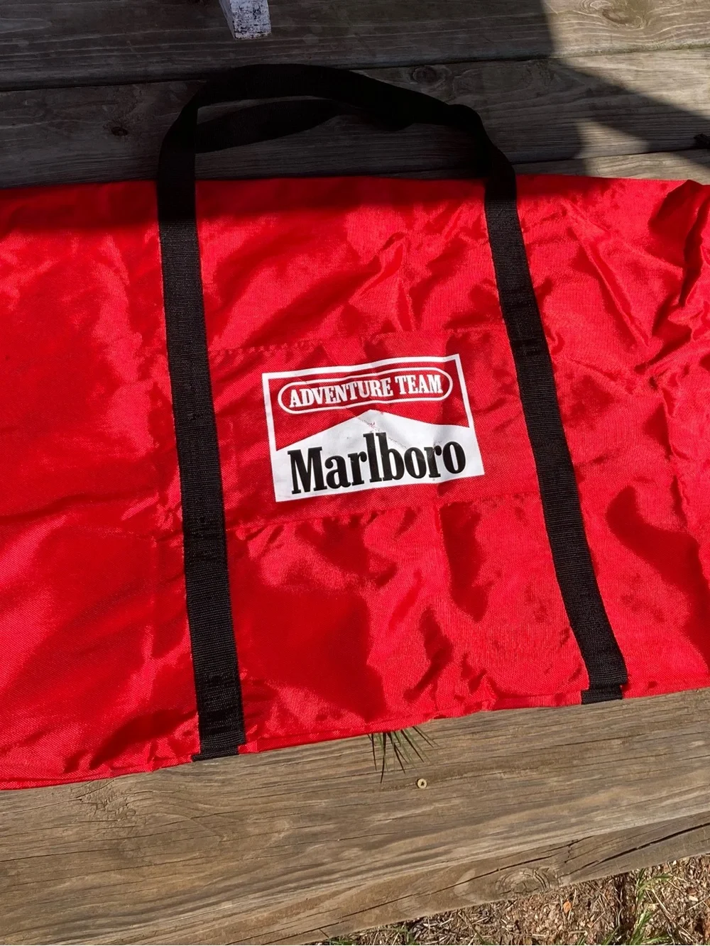 Marlboro Red Duffel with Black Web Handles and Adventure Team Logo