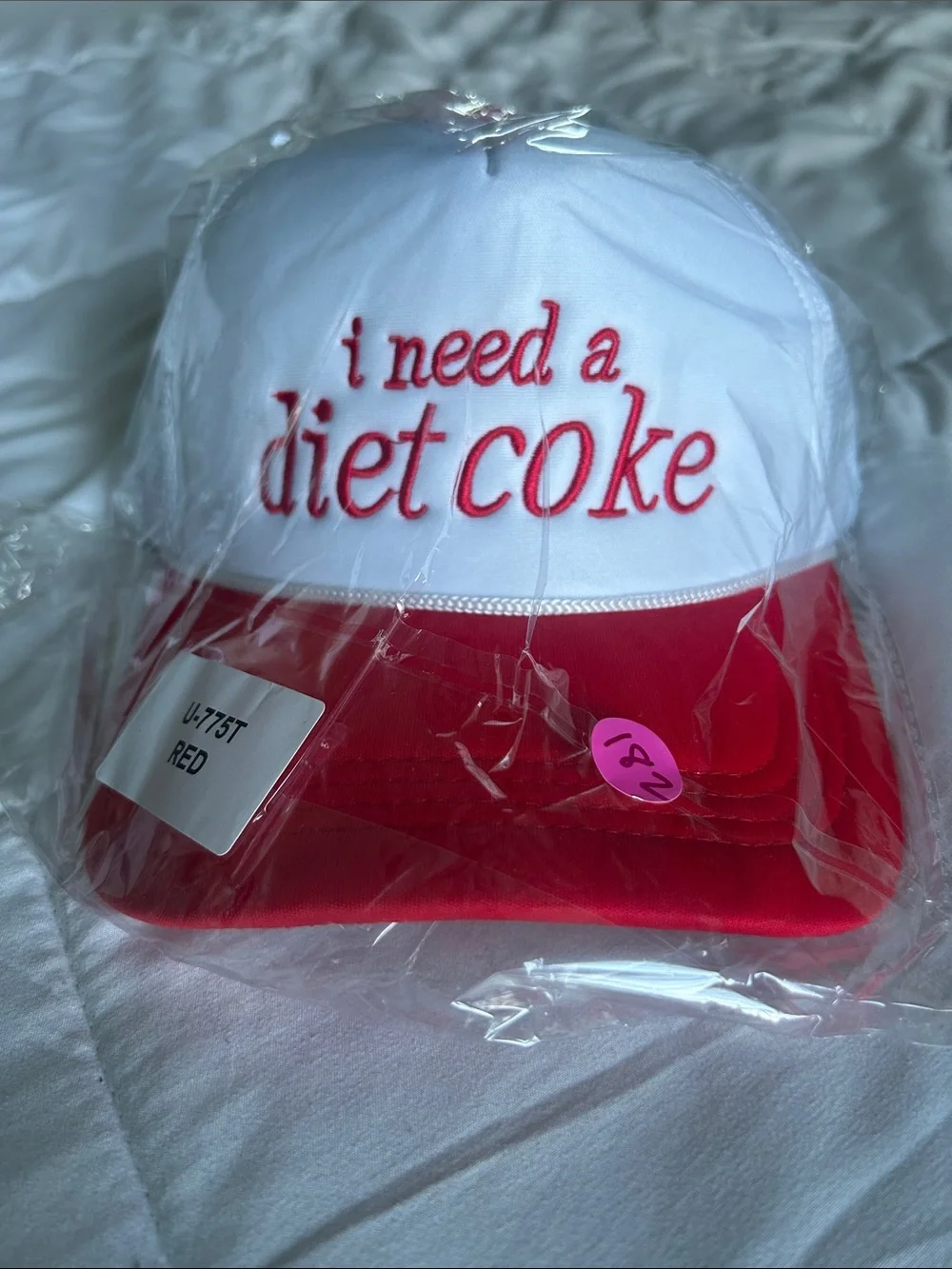 New in the poly bag!  White and Red Embroidered 'i need a diet coke' Trucker Hat