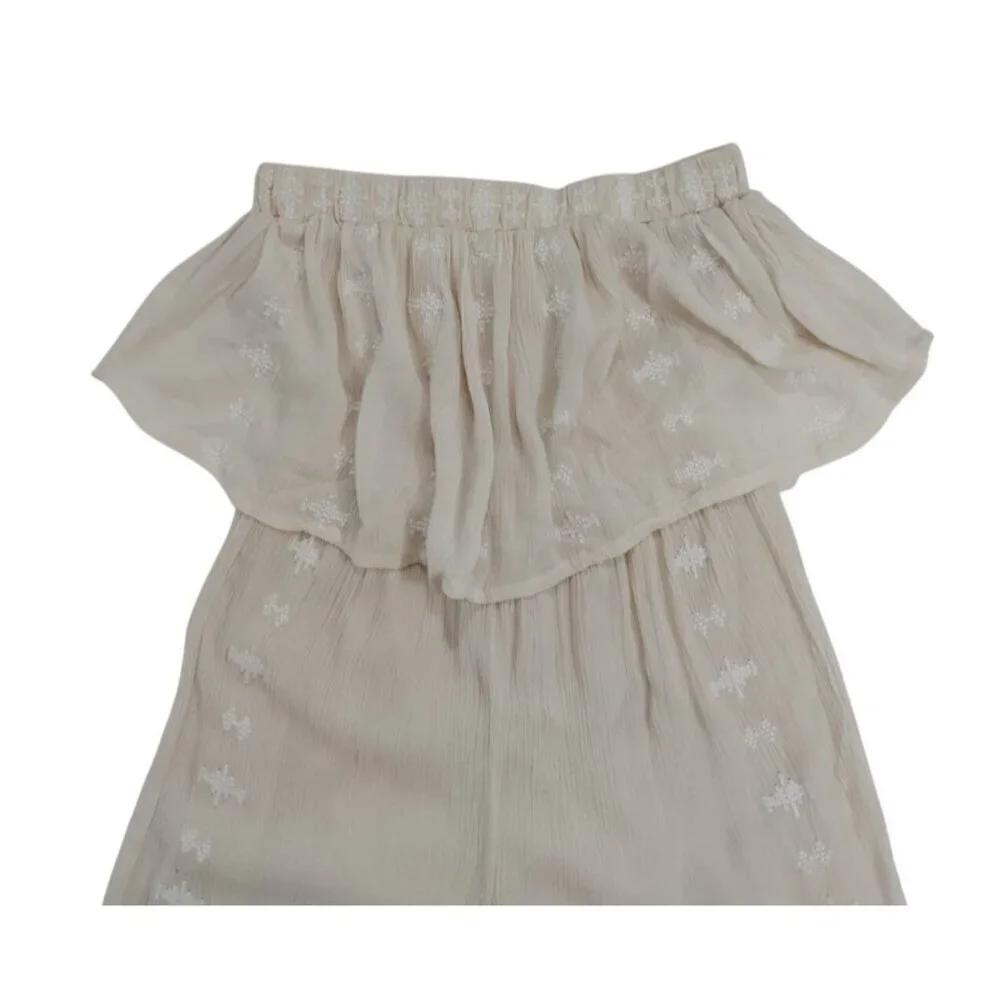 Women's beige offthe-shoulder ruffle jumpsuit with embroidered detail, wide leg