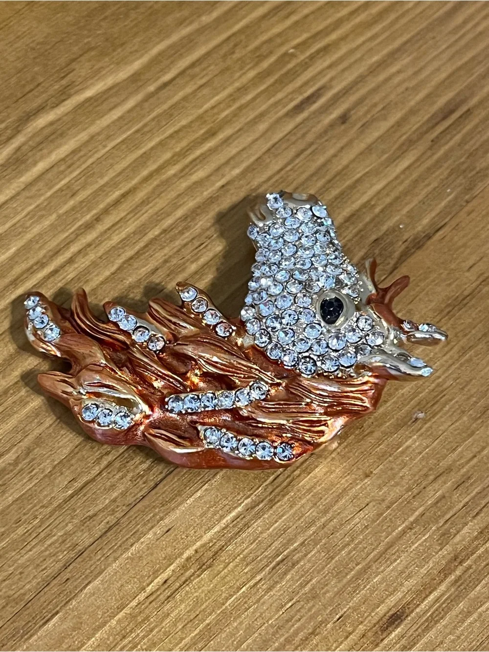 None this brooch