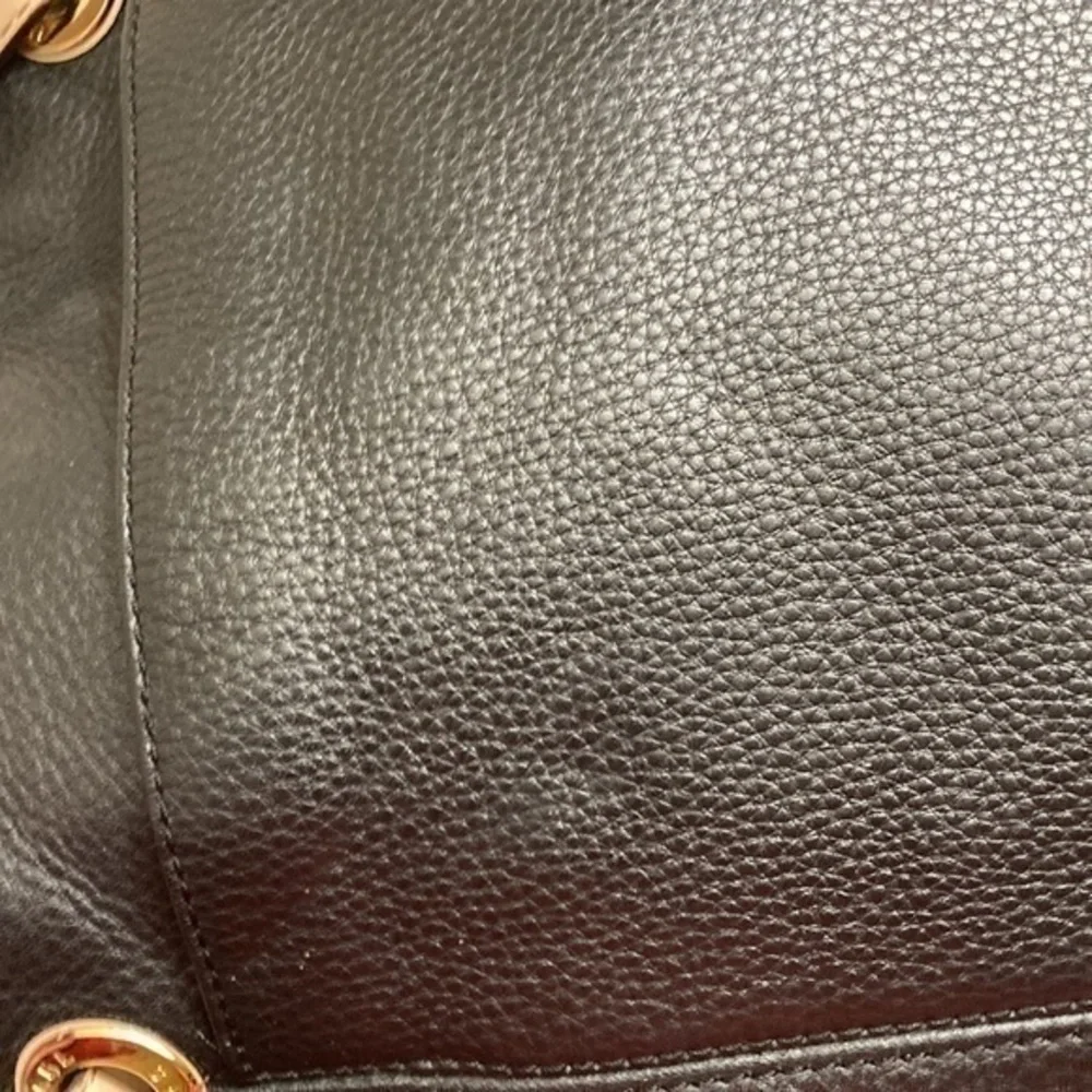 Michael Kors scuffs around