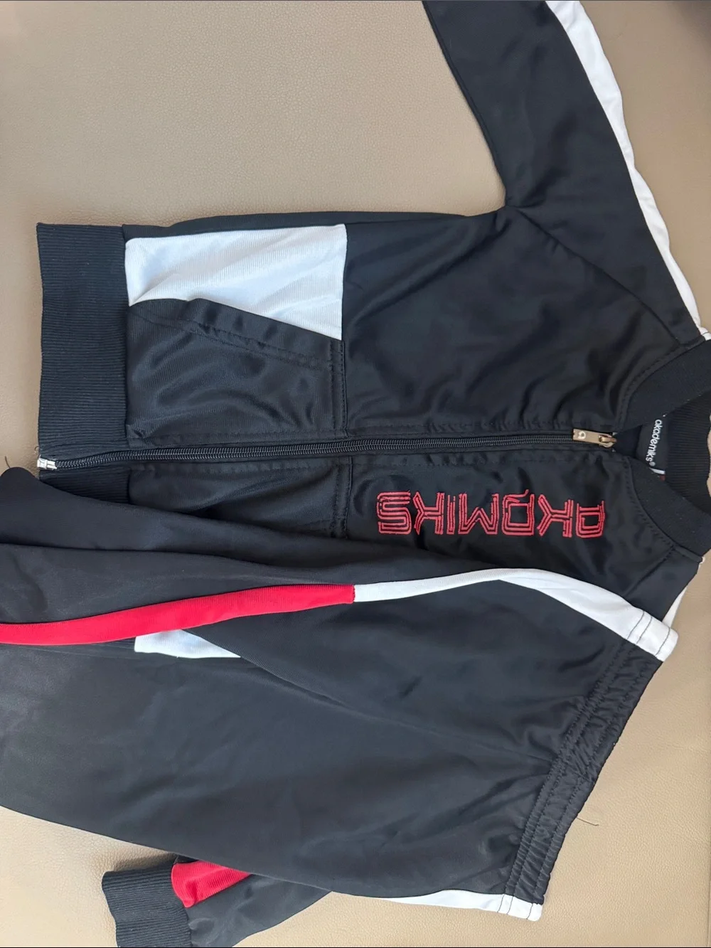 Black Athletic Jacket with Red and White Accents