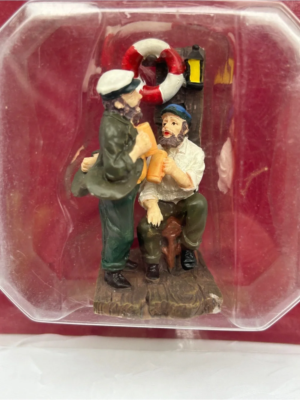 Christmas village chatting sailors