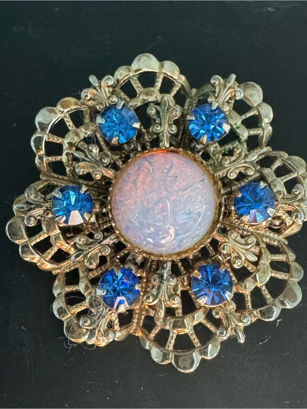 10k test Gold-Tone Filigree Brooch with Iridescent Center and Blue Rhinestones