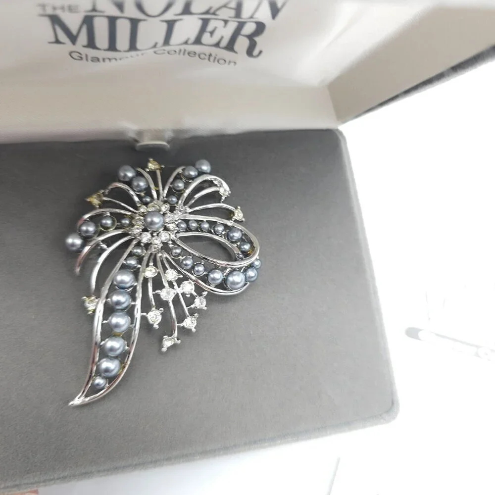Nolan Miller looking brooch
