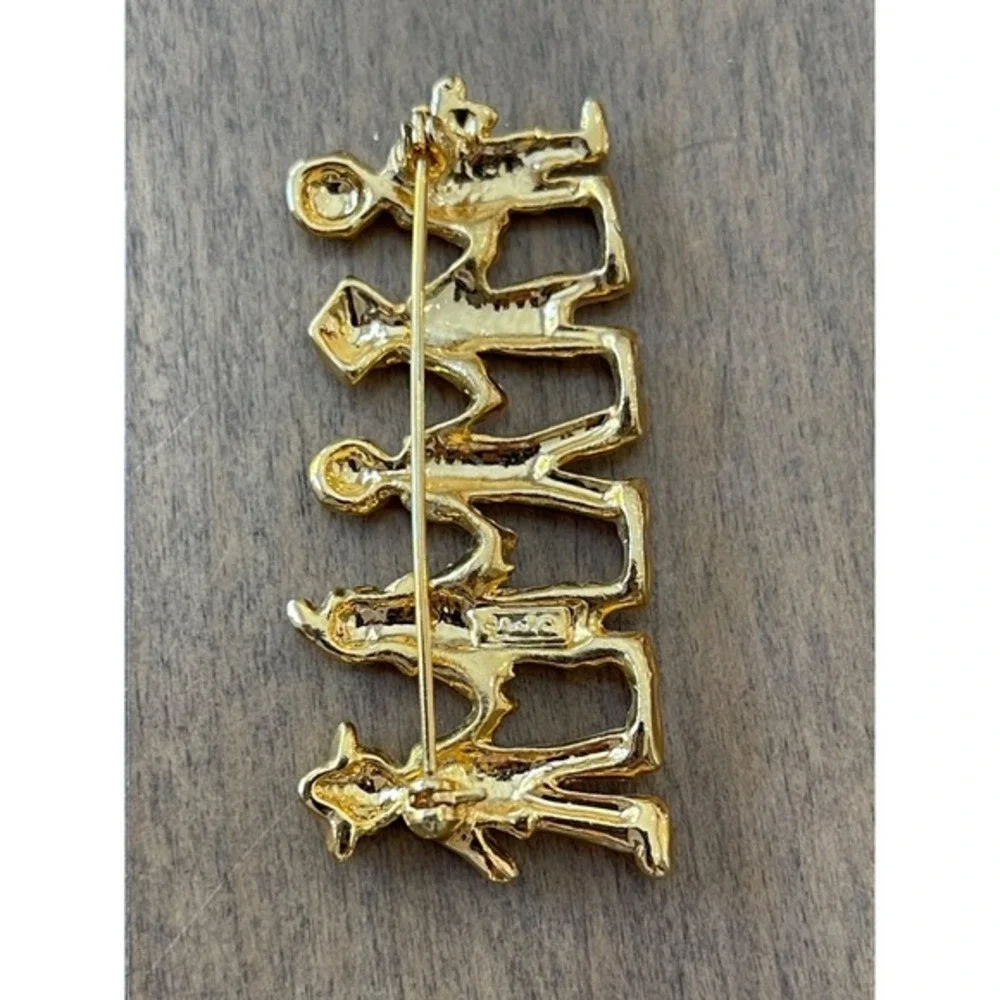 Ajc this brooch