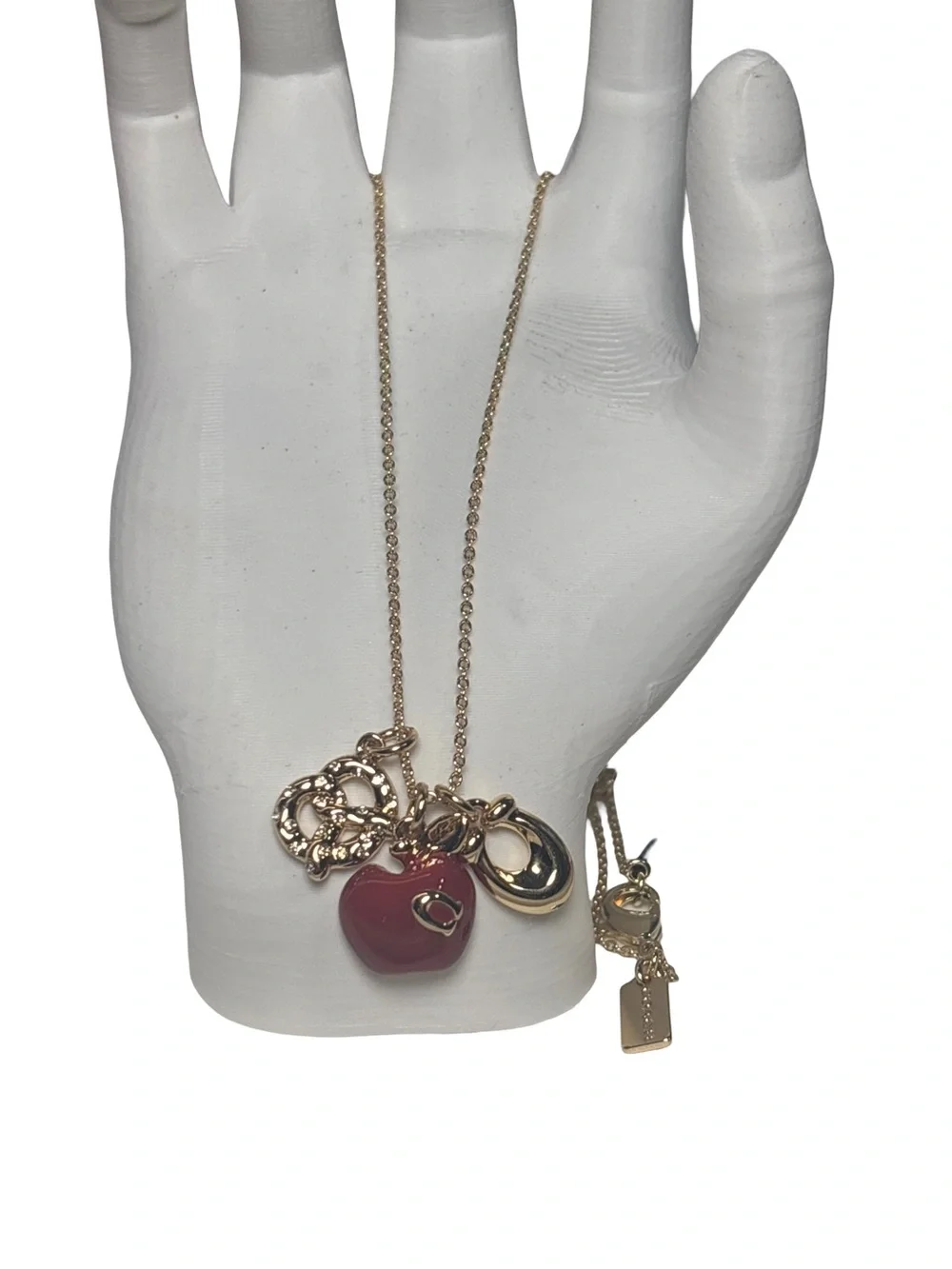 Coach Gold-Tone Charm Pendant Necklace with Red Apple and Pretzel Accents