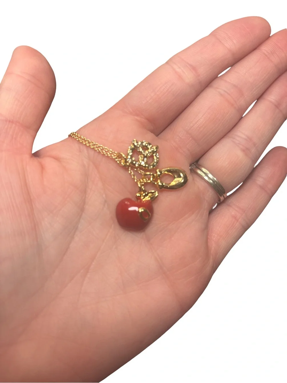 Coach Gold-Tone Charm Pendant Necklace with Red Apple and Pretzel Accents