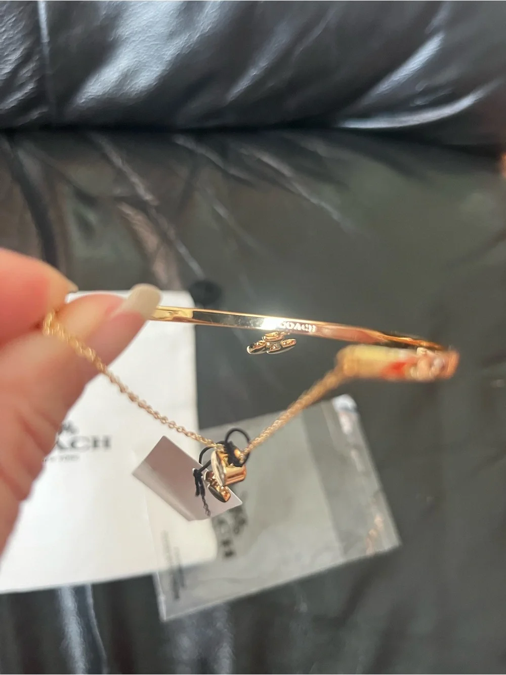 Coach gold tone