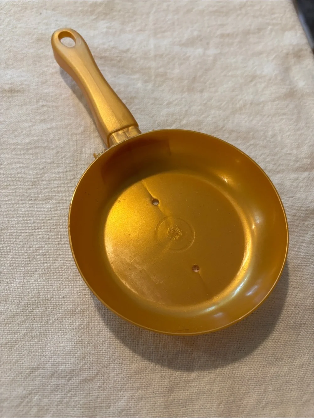 Source Unknown gold plastic