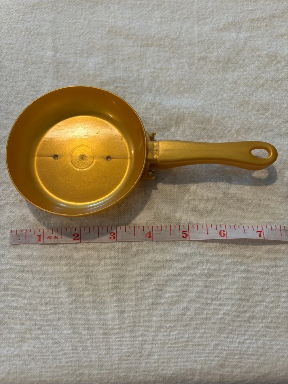 Source Unknown gold plastic