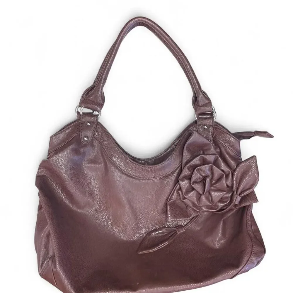 Brown leather handbag with flower